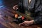 Closeup photo of women hands with chopsticks, eating sushi rolls