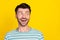 Closeup photo of young attractive guy excited look empty space smiling crazy sale isolated on yellow color background