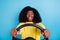 Closeup photo of young driving woman holding car steering wheel shocked high speed isolated on blue color background