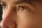 Closeup photo of young man eye with a tear. Man crying