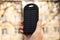 Closeup photography of man`s hand,holding powerbank with solar battery