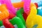 Closeup photography of multicolored curved pop tubes.Trendy antistress toy for children