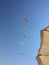 A closeup pic of a group of a colored group of flying kites