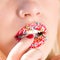 Closeup picture on beautiful young lady seductive plump lips sprinkled with sweet crumbs