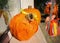 Closeup picture of decorative orange pumpkins made of paper in a sunny day