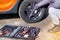 Closeup picture of mechanical tools box. Car driver using different repair tools for repairing and diagnostic an orange car. Tool