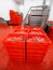 Closeup picture of a plastic red boxes with chopped fresh raw meat, worker arranged a stored in a meat factory