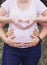 Closeup pictures of pregnant woman`s belly with hands
