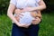 Closeup pictures of pregnant woman`s belly with hands