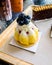 Closeup of piece blueberry cake on the wooden plate