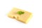 Closeup of a piece of Swiss cheese with mint isolated on a white background