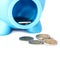 Closeup piggy bank with coins on white isolated background