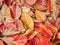 Closeup of a pile of autumn colorful persimmon leaves