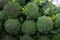 Closeup of the pile of broccoli on the market,Fresh, healthy, organic vegetables such as broccoli for sale at a farmer`s marke at