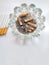 Closeup of a pile of cigarettes over white background. The tobacco can cause numerous damages to the organism