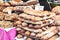 Closeup of pile of fresh French artisan sourdough baguettes and whole grain cereal and pumpkin seed breads London street