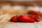 Closeup of a pile of freshly baked piquillo peppers on a rag, in Lodosa