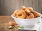 Closeup of a pile of homemade rosquillas, traditional homemade anise donuts from Spain, typically eaten in Easter, on a rustic