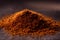 Closeup of a pile of spice on the table under lights