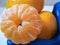 Closeup of pilled mandarine on a top of a pile