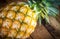 Closeup pineapple on wooden background.