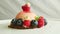 Closeup pink icing dessert trendy decorated with berries rotates on plate