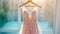 Closeup pink rose wedding dress in bridal room background. Banner. Front view of stylish dress for wedding day. Beautiful clothes