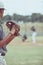 Closeup of a pitcher playing a baseball match. Sports player in action about to throw the ball to a batter. Competitive