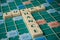 Closeup of plastic letters with words lucky and chance on Scrabble board game