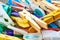 Closeup of plastic and wooden clothespins in a basket