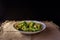 Closeup of a plate of broccoli pasta on a sackcloth