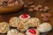 Closeup plate with Catalan panellets and some roasted almonds on a wooden table. Typical desert in Catalonia for Halloween La