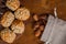 Closeup plate with Catalan panellets and some roasted almonds on a wooden table. Typical desert in Catalonia for Halloween La