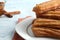 Closeup plate of churros covered in sugar and cinnamon