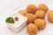 Closeup of a plate with croquetas, spanish croquettes, on a set table