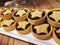 A closeup of plate full of a row of tasty christmas berry tarts with a star design
