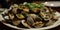 Closeup of a plate of steamed clams.