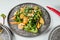 Closeup of a plate of tempura with fresh vegetables on the white table