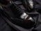 A closeup of a polished leather oxford with a textured black sock representing timeless business fashion.. AI generation