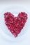 Closeup pomegranate berries in a heart shape