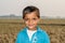 Closeup of a poor staring hungry orphan boy in a refugee camp with sad expression on his face and his face and clothes are dirty