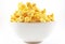 Closeup popcorn in white bowl on isolated background