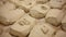 Closeup of portioned pieces of dough prepared for shaping and rolling on wooden working surface with flour in bakery