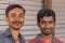Closeup portrait of 2 young smiling men, Chikkanayakanahalli, Karnataka, India