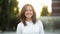 Closeup Portrait of Amazing Brunette Looking at the Camera and Laughing During Summer Sunset in the City. Pretty Woman