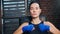 Closeup portrait of Asian girl making threatening gestures having aggressive emotion at boxing ring