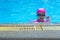 Closeup portrait Asian girl with swimming suite and eyeglasses in the pool