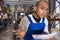 Closeup portrait of astonished hispanic warehouse worker with papers