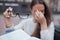 Closeup portrait of attractive female with eyeglasses in hand. Poor young girl has issues with vision. She rubs her nose and eyes