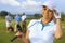 Closeup portrait of attractive female golfer